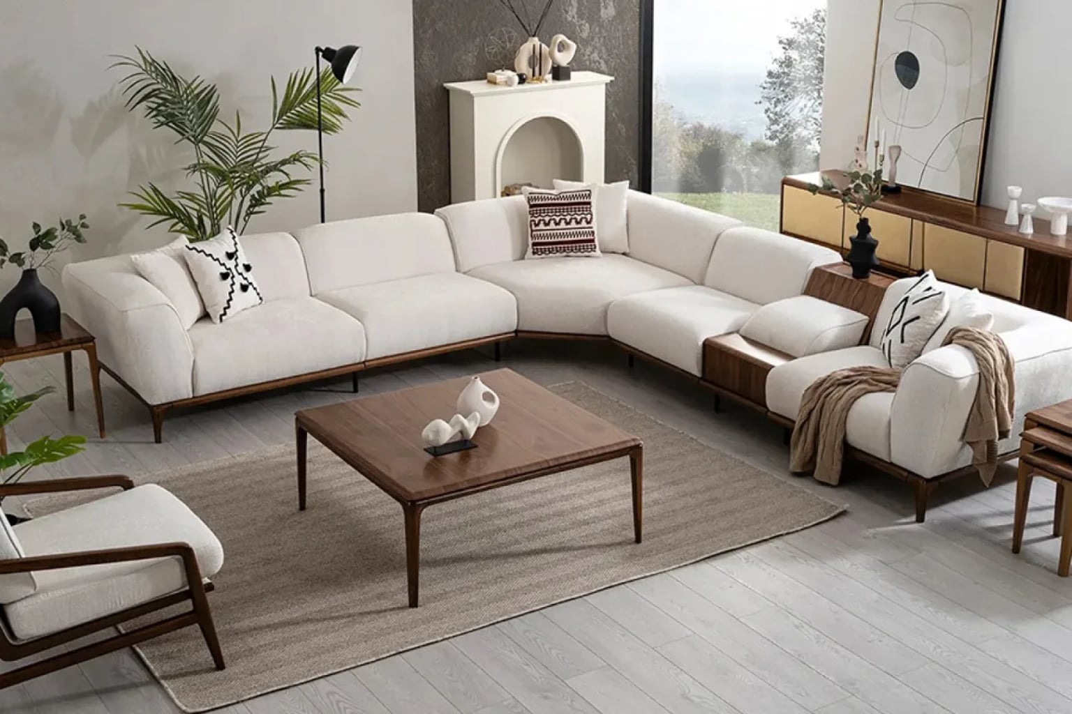 Şık bir koltuk takımının ve konsolun, sıcak aydınlatma ile vurgulandığı modern bir salon görüntüsü.